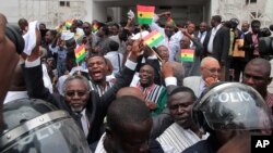 FILE - On Aug. 29, 2013, supporters celebrate the supreme court's decision to uphold the results of a presidential election outside the court in Accra, Ghana. The election of John Mahama was confirmed.