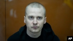 Alexander Permyakov, a Ukrainian national tried in connection with a car bombing that injured nationalist writer Zakhar Prilepin, sits at the Russian Military Court in Moscow, Sept. 30, 2024. Permyakov was convicted and given a life sentence.