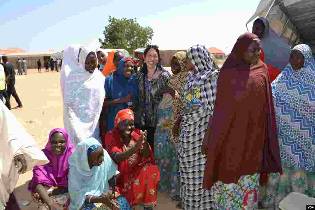 U.S. Deputy U.N. Ambassador Michelle Sison spoke out at every stop on the need for the protection of women and girls. Here she talks with women in Maiduguri IDP camp. (M. Besheer/VOA)