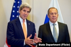 FILE - U.S. Secretary of State John Kerry, flanked by Russian Foreign Minister Sergey Lavrov, answers a reporter's question on Sept. 9, 2016, at the Hotel President Wilson in Geneva, Switzerland, before they begin a bilateral meeting focused on Syria.