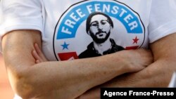 FILE - In this June 5, 2021, photo, a person wears a T-shirt calling for the release of US journalist Danny Fenster from detention in Myanmar, in Huntington Woods, Michigan.