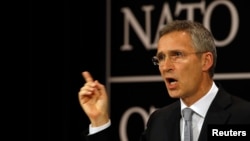 FILE - NATO Secretary General Jens Stoltenberg, shown here at a news conference in Brussels, Belgium, July 13, 2016, says going it alone on defense and security is not an option for neither the United States nor for Europe.