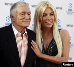 Hugh Hefner and his fiancee, Playboy Playmate Crystal Harris, arrive at the opening night gala of the 2011 TCM Classic Film Festival featuring a screening of a restoration of 'An American In Paris' in Hollywood, California, April 28, 2011.