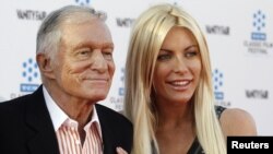 Hugh Hefner and his fiancee, Playboy Playmate Crystal Harris, arrive at the opening night gala of the 2011 TCM Classic Film Festival featuring a screening of a restoration of 'An American In Paris' in Hollywood, California, April 28, 2011. 