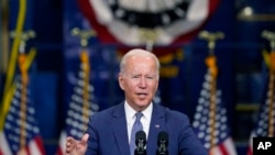 FILE - President Joe Biden delivers remarks at NJ Transit Meadowlands Maintenance Complex to promote his 'Build Back Better' agenda, in Kearny, N.J., Oct. 25, 2021.