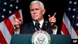 FILE - In this Aug. 9, 2018 photo, Vice President Mike Pence gestures during an event on the creation of a U.S. Space Force at the Pentagon. 