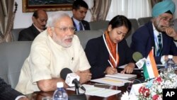 India's Prime Minister Narendra Modi (L) attends a meeting with Seychelles President James Alix Michel in the capital Victoria, Seychelles, March 11, 2015.