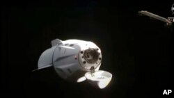 This image from video provided by NASA shows the SpaceX Dragon approaching the International Space Station, Nov. 11, 2021. 