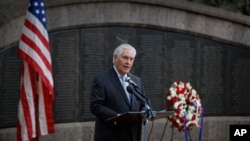 U.S. Secretary of State Rex Tillerson speaks to survivors after laying a wreath during a ceremony at Memorial Park in honor of the victims of the deadly 1998 U.S. Embassy bombing, in Nairobi, Kenya, March 11, 2018.