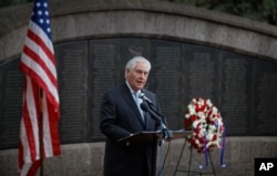 U.S. Secretary of State Rex Tillerson speaks to survivors after laying a wreath during a ceremony at Memorial Park in honor of the victims of the deadly 1998 U.S. Embassy bombing, in Nairobi, Kenya, March 11, 2018.