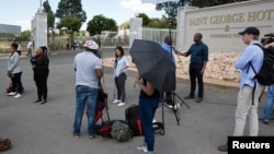 Members of the media gather outside a hotel where members of the African National Congress (ANC) National Executive Committee are meeting to decide the fate of President Jacob Zuma, in Pretoria, South Africa, Feb. 12, 2018.