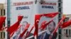 Turkey's President Recep Tayyip Erdogan's ruling Justice and Development Party's (AKP) campaign poster is seen in Instanbul's Taksim Square, April 4, 2019.