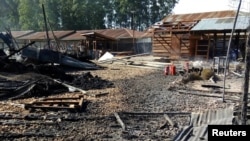 FILE - Burned structures are seen after attackers set fire to an Ebola treatment center run by Medecins Sans Frontieres (MSF) in the east Congolese town of Katwa, Democratic Republic of Congo, Feb. 25, 2019. Picture taken February 25, 2019. (Laurie Bonnaud/MSF)