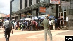 Even an introduction of Zimbabwe’s own currency called “bondnotes” which trade at par with the U.S. dollar, in November last year, has not helped ease an acute shortage of cash which is forcing some people to lots of time in bank queues, Gokwe, Zimbabwe, 