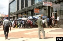 Even an introduction of Zimbabwe’s own currency called “bondnotes” which trade at par with the U.S. dollar, in November last year, has not helped ease an acute shortage of cash which is forcing some people to lots of time in bank queues, Gokwe, Zimbabwe,