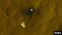 This color view of the parachute and back shell that helped deliver NASA's Curiosity rover to the surface of the Red Planet was taken by the High-Resolution Imaging Science Experiment (HiRISE) camera on NASA's Mars Reconnaissance Orbiter. 