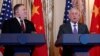 Secretary of State Mike Pompeo looks to Secretary of Defense Jim Mattis during a news conference with Chinese officials at the State Department in Washington, Nov. 9, 2018.