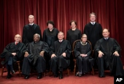 FILE - The justices of the U.S. Supreme Court gather for a formal group portrait at the Supreme Court Building in Washington, Nov. 30, 2018.