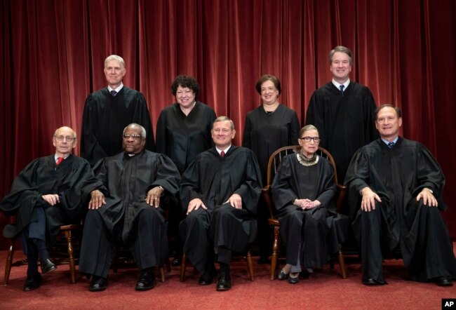 FILE - The justices of the U.S. Supreme Court gather for a formal group portrait at the Supreme Court Building in Washington, Nov. 30, 2018.