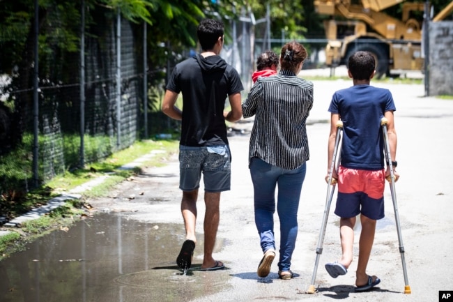 FILE - Refugees are pictured on Nauru, Sept. 4, 2018. Psychiatric and physical suffering of children has been the major criticism of the government’s policy since 2013 to send asylum seekers who attempt to reach Australia by boat to an immigration camp on Nauru or men-only facilities on Papua New Guinea.