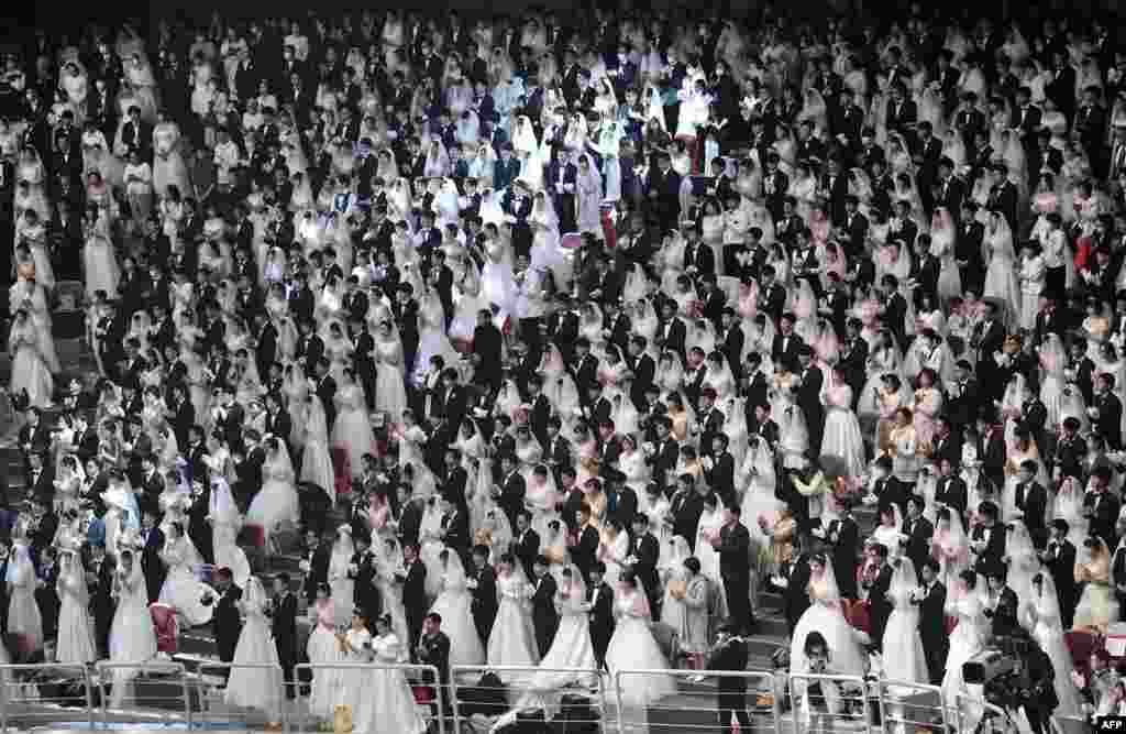 Couples attend a mass wedding ceremony organized by the Unification Church at Cheongshim Peace World Center in Gapyeong, South Korea.