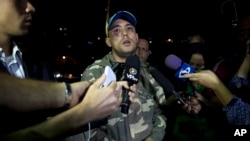 FILE - Venezuelan journalist Jesus Medina Ezaine speaks with press in Caracas, Venezuela, on Nov. 7, 2017. Medina escaped Venezuela in 2024 and is in exile after years of persecution by the government of President Nicolas Maduro.