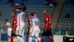 United States' Jozy Altidore, left, reacts after missing a chance to score during a 2018 World Cup qualifying soccer match against Trinidad and Tobago in Couva, Trinidad, Oct. 10, 2017.