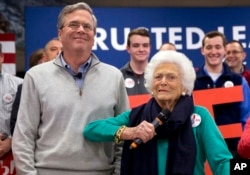 Barbara Bush jokes with her son, Republican presidential candidate Jeb Bush, while introducing him at a town hall meeting at West Running Brook Middle School in Derry, N.H., Feb. 4, 2016.
