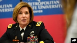 US Army General Laura Richardson responds to questions from reporters before speaking at the commencement ceremony of her alma mater, Metropolitan State University of Denver, Dec. 17, 2021, in Denver. 