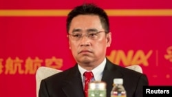 FILE - Wang Jian, of HNA Group, attends a meeting marking the 20th anniversary of company's founding in Haikou, Hainan province, China, April 28, 2013.