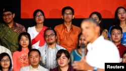 Participants listen as U.S. President Barack Obama holds a town hall-style meeting with a group of Young Southeast Asian Leaders Initiative (YSEALI) attendees, alongside his participation in the ASEAN Summit, at Souphanouvong University in Luang Prabang, 