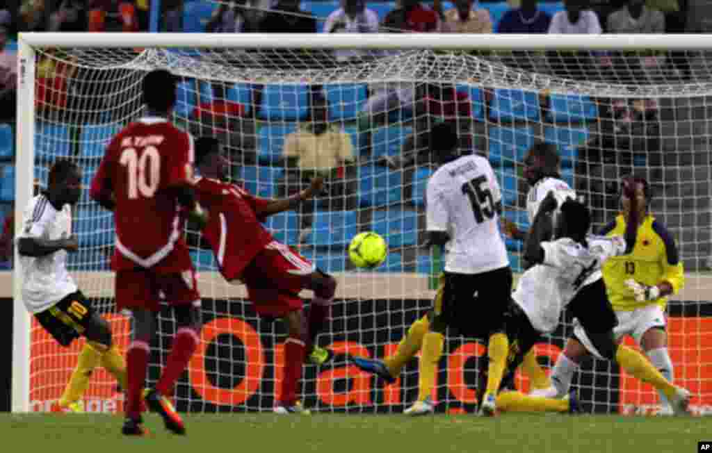 Sudan's Bashir scores against Angola during their African Nations Cup soccer match in Malabo