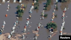 Rows of vehicles lie flooded as search-and-rescue teams fanned out across Colorado. Sept. 17, 2013.