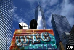 FILE - In this Aug. 1, 2018, photo, artist Lynne Yun's mural project on a corrugated metal shed is seen near One World Trade Center in Lower Manhattan in New York.