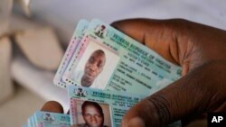 FILE - An electoral official checks permanent voters cards at a distribution centre in Lagos, ahead of Feb. 2023 Presidential elections in Lagos, Nigeria, Wednesday, Jan. 11, 2023.