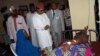 FILE - Senator Shehu Sani visit an injured man in a hospital on the outskirts of the city of Zaria, in Kaduna state, Nigeria, July 8, 2015. Sani's revelation that Nigerian senators draw a monthly allowance worth $37,500, in addition to their regular salaries, has drawn widespread anger. 