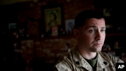 FILE - U.S. Marine Sergeant Lawrence Hutchins III poses for a portrait.