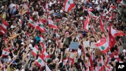 Anti-government protesters shout slogans in Beirut, Lebanon, Oct. 20, 2019. 