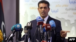 Emad Al-Sayh, chief of Libya's High National Election Commission, speaks during a press conference in the capital Tripoli on Dec. 6, 2018. 