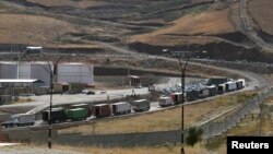 Trucks are seen at Haj Omran border, on the border between Iran and Kurdistan, Iraq, Oct. 14, 2017. 
