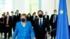 German Foreign Minister Heiko Maas, center right, and U.S. Secretary of State Antony Blinken, center left, talk after a group photo during the 'Second Berlin Conference on Libya' at the foreign office in Berlin, Germany, June 23, 2021. 