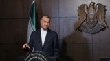 Iranian Foreign Minister Hossein Amirabdollahian speaks during a joint news conference with Syrian Foreign Minister Faisal Mekdad in Damascus