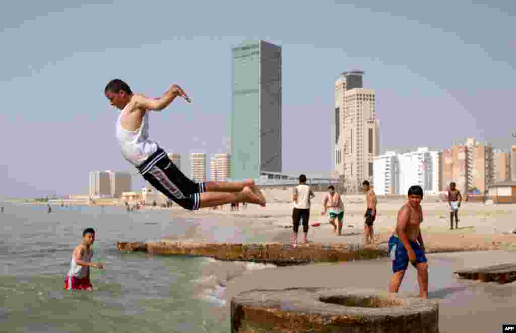 May 3: Libyans enjoy a day on a beach in Tripoli, Libya. (AP Photo/Darko Bandic)