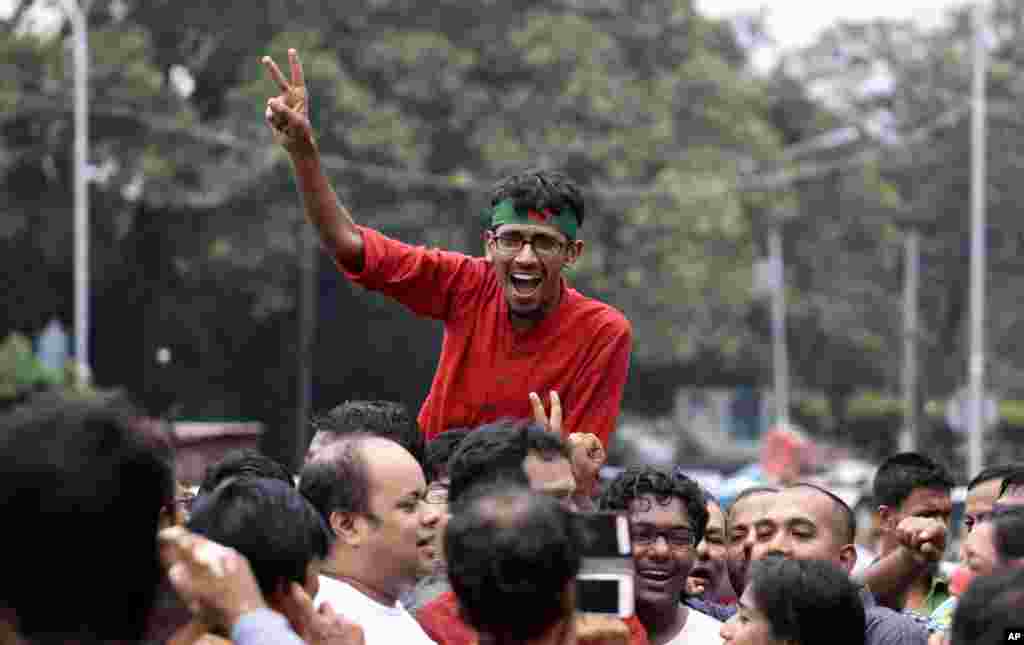 An activist celebrates the verdict against Jemaat-e-Islami party leader Abdul Quader Mollah in Dhaka, Sept. 17, 2013.