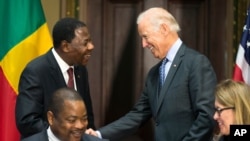 Vice President Joe Biden, right, shakes hands with Benin's president Thomas Boni Yayi, during a Compact Signing Ceremony on Sept. 9, 2015, in Washington. The compact is for a $375 million Millennium Challenge Corporation grant.