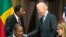 Vice President Joe Biden, right, shakes hands with Benin's president Thomas Boni Yayi, during a Compact Signing Ceremony on Sept. 9, 2015, in Washington. The compact is for a $375 million Millennium Challenge Corporation grant.