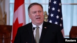 U.S. Secretary of State Mike Pompeo speaks during a news conference after the U.S.-Canada ministerial meeting at the State Department in Washington, Dec. 14, 2018. 