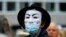 A demonstrator wears a Guy Fawkes mask during a protest against the Swiss government's measures to slow down the spread of the coronavirus disease (COVID-19), at the Helvetiaplatz square in Zurich, Switzerland, Aug. 29, 2020. 