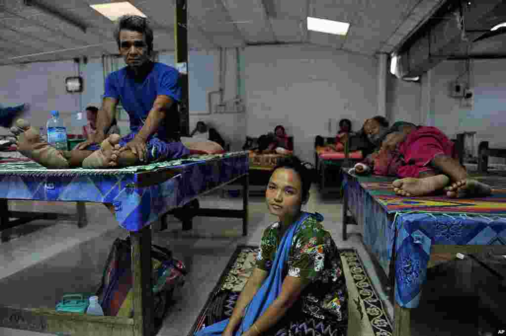 Refugees from eastern Burma waiting for treatment in the waiting room of the surgery department of the Mae Tao clinic in the western Thai border town of Mae Sot, May 7, 2011.