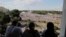 People watch as Belarusian opposition supporters rally in the center of Minsk, Belarus, Aug. 16, 2020. 